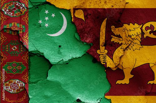 flags of Turkmenistan and Sri Lanka painted on cracked wall photo