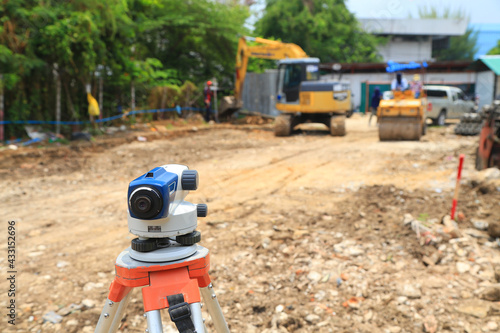 Level camera and elevation survey of road construction.