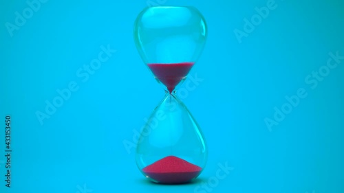 Sand flowing through the hourglass, measuring the elapsed time in the countdown to the deadline on a blue background.