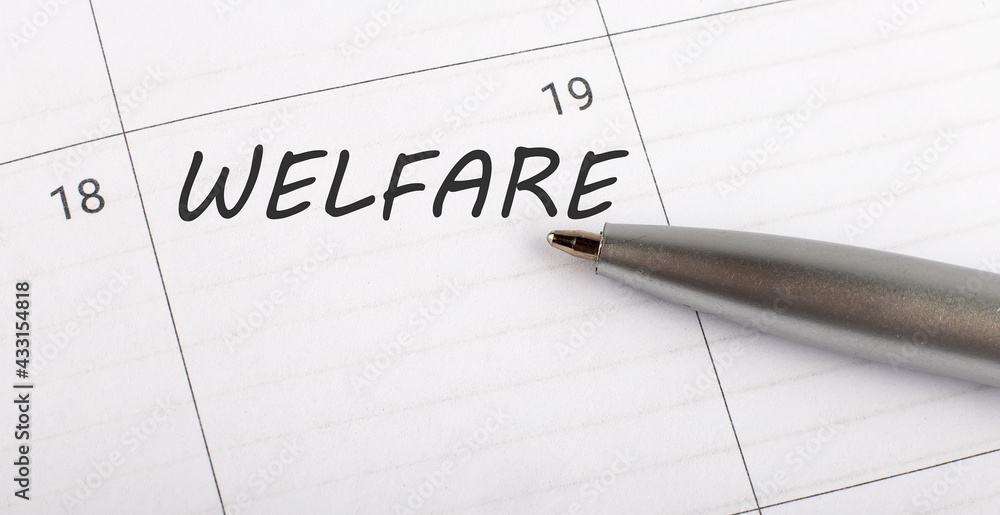 Text welfare on calendar planner to remind you an important appointment with a pen on isolated white background. Text welfare on calendar planner to remind you an important appointment with a pen on isolated white background.