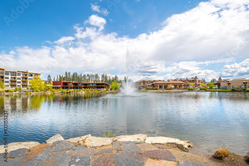 Riverstone public park and lake with the water fountain during spring in the Riverstone commercial development in downtown Coeur d'Alene, Idaho, USA
