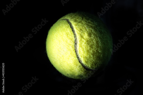 Dramatically Lit Isolated Angled Tennis Ball © David Arsham