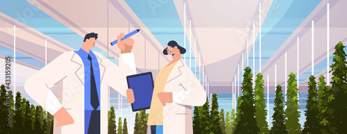 agricultural engineers researching plants and writing results in tablet smart farm agriculture scientist concept