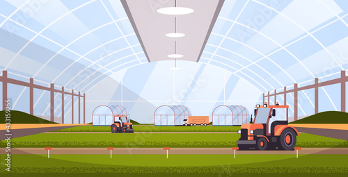 tractors working on organic products industrial plantation growing plants smart farming agribusiness concept