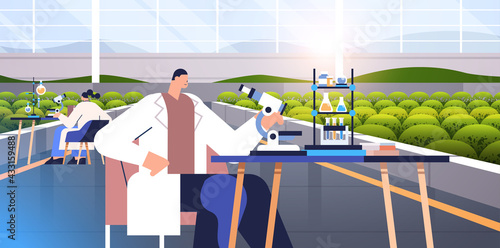 agricultural engineers researching plants scientists making chemical experiments in lab agriculture smart farming