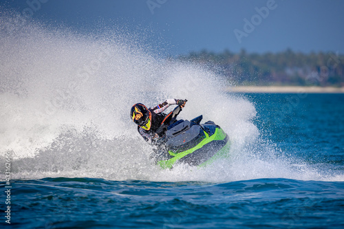 A man driving a jet ski © nattawut