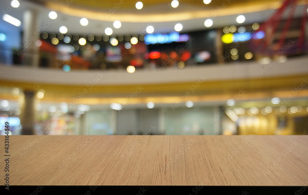 Empty wooden table in front of abstract blurred background of coffee shop . can be used for display or montage your products.Mock up for display of product Empty wooden table in front of abstract blurred background of coffee shop . can be used for display or montage your products.Mock up for display of product
