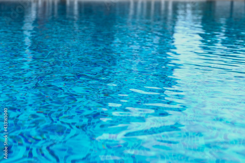Abstract pool water.  Swimming pool flow with waves background surface of blue swimming pool