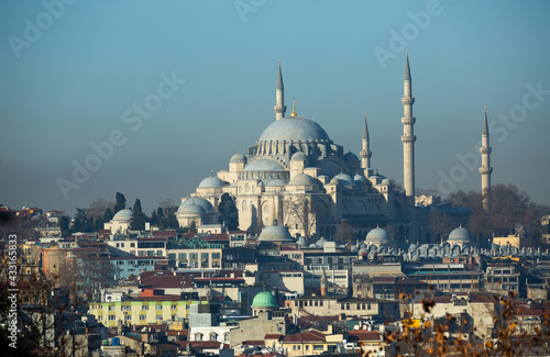 Scenic modern Istanbul cityscape overlooking Fatih district and ancient Suleymaniye Mosque on sunny winter day, Turkey..