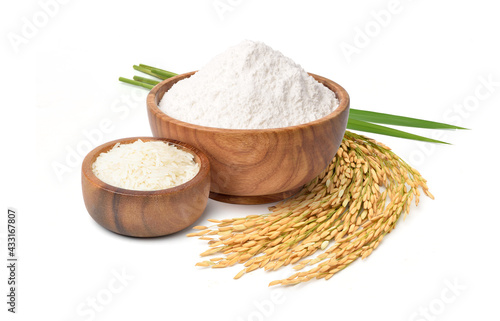 White flour  in wooden bowl with white rice and rice ears isolated on white background.
