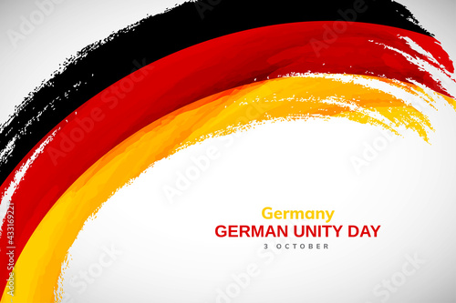 Happy german unity day of Germany with watercolor brush stroke flag background with abstract watercolor grunge brush flag
