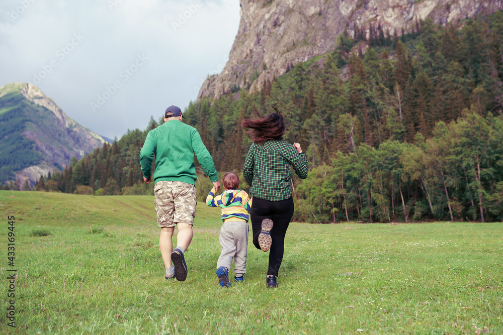 family walking in the mountains