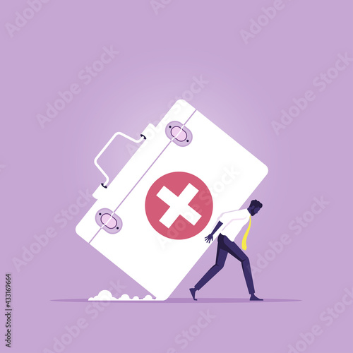 Health care costs or medical insurance concept, Businessman carrying big Medical box as Costly expensive pricey medical insurance