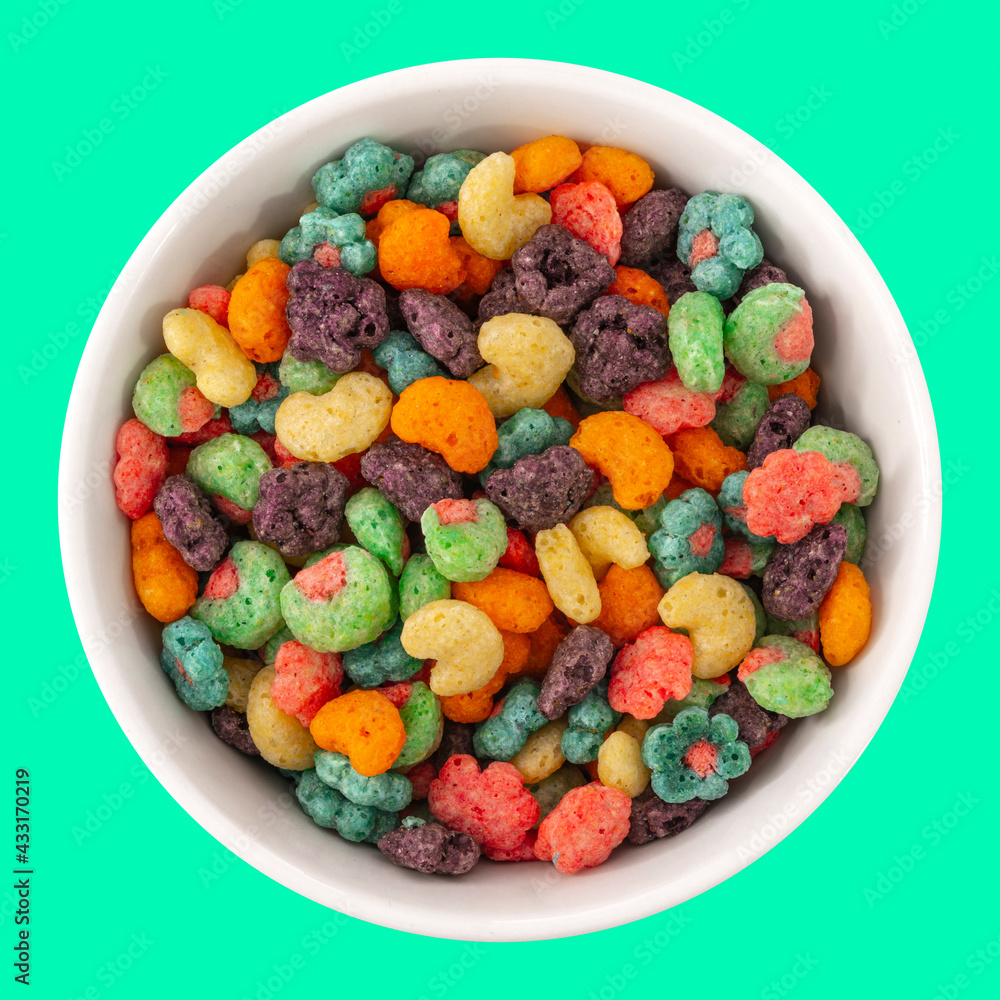 Top view of bowl with fruit cereal naturally and artificially fruit flavored sweetened corn puffs. Cereal fruity shapes Top view of bowl with fruit cereal naturally and artificially fruit flavored sweetened corn puffs. Cereal fruity shapes