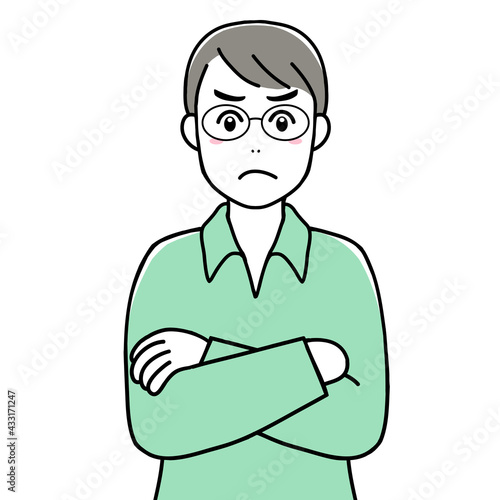 An angry young man with his arms crossed
