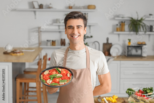 Young man with tasty pizza ...