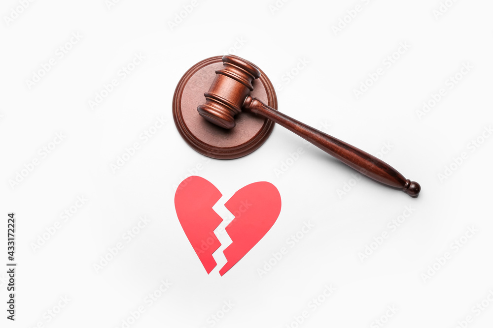 Judge's gavel and broken heart on white background