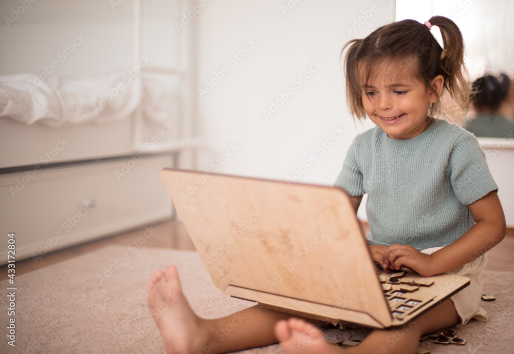 Toddler playing interactive games for good development at home. Toddler playing interactive games for good development at home.
