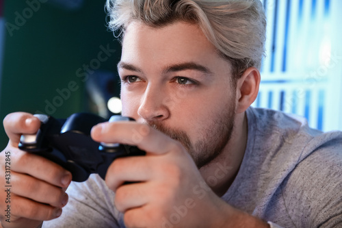 Young man playing video gam...
