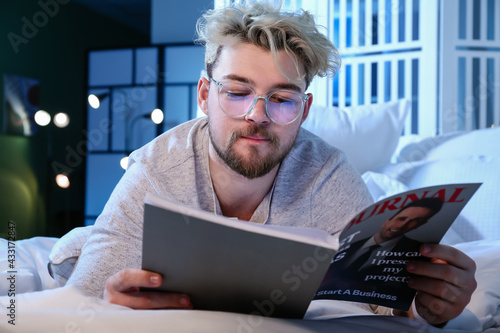 Young man wearing glasses w...