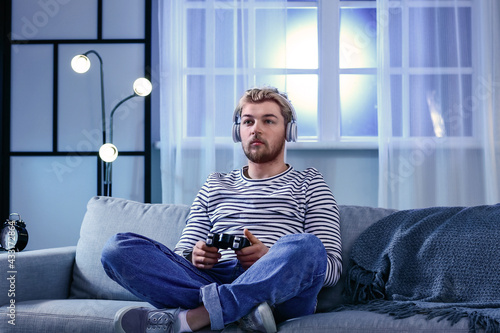 Young man playing video gam...