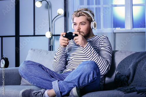 Young man with headphones p...