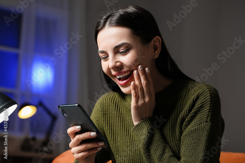 Young woman with mobile pho...