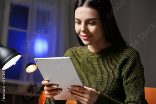 Young woman with tablet com...