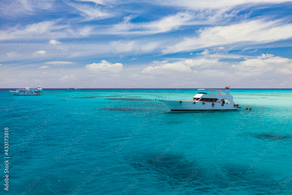 Cruise yacht bow in clear water near a coral reef. Red Sea, Egypt Cruise yacht bow in clear water near a coral reef. Red Sea, Egypt