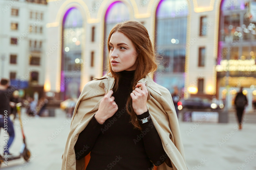 young beautiful woman posing and walking in the center of a big city young beautiful woman posing and walking in the center of a big city