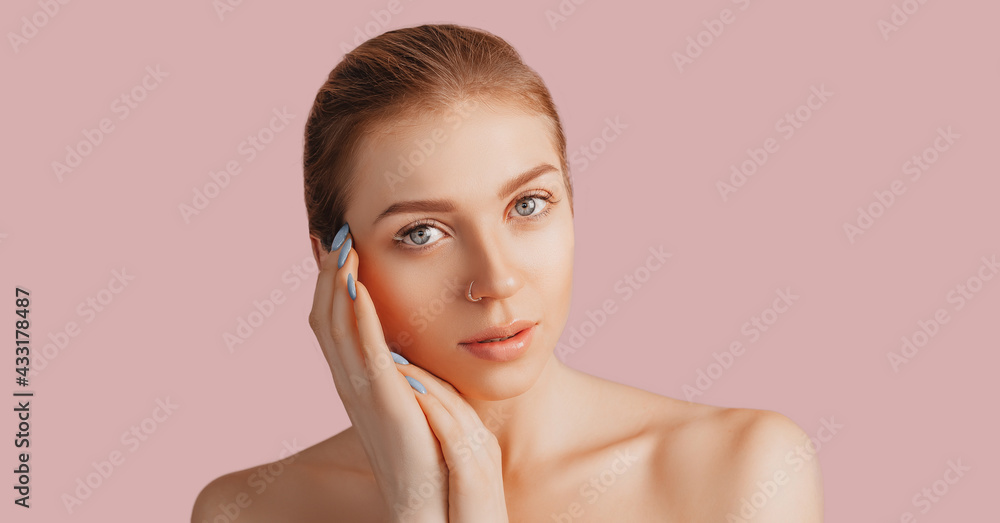 Beautiful sensual young girl with clean skin on a pink background with a mockup. Topless woman. The concept of spa treatments, natural beauty and care, youth, cream and mask, freshness Beautiful sensual young girl with clean skin on a pink background with a mockup. Topless woman. The concept of spa treatments, natural beauty and care, youth, cream and mask, freshness