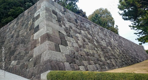 A large historical stone wall of Edo Castle in Tokyo photo