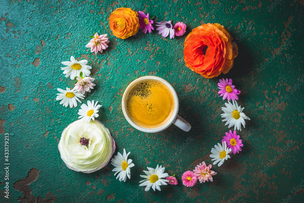 Cup of coffee with variation of flowers on green background - obrazy, fototapety, plakaty 