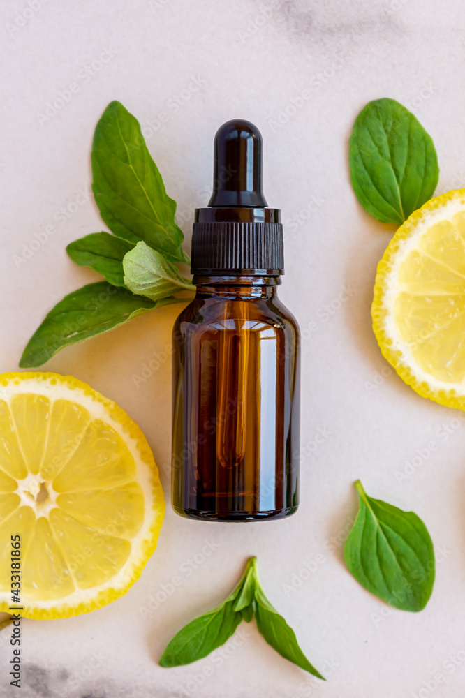 Dark glass bottle with Citrus fruit essential oil, vitamin c serum, beauty care aroma therapy Dark glass bottle with Citrus fruit essential oil, vitamin c serum, beauty care aroma therapy