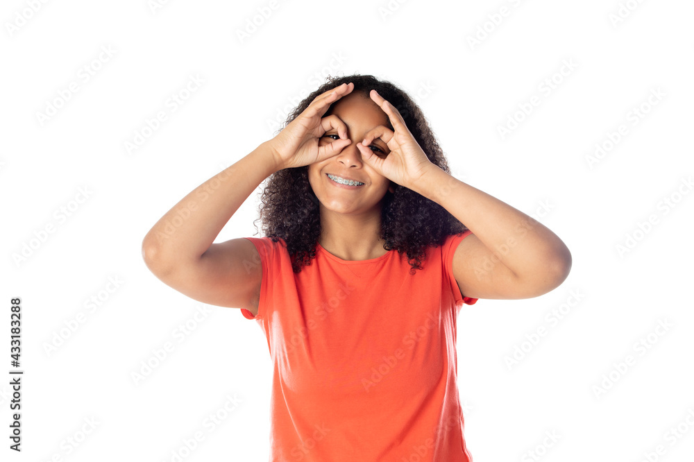 Close up of smiling little african american kid girl wearing red t-shirt looking at camera isolated on a white background Close up of smiling little african american kid girl wearing red t-shirt looking at camera isolated on a white background