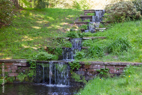A small cascading waterfall in the park
