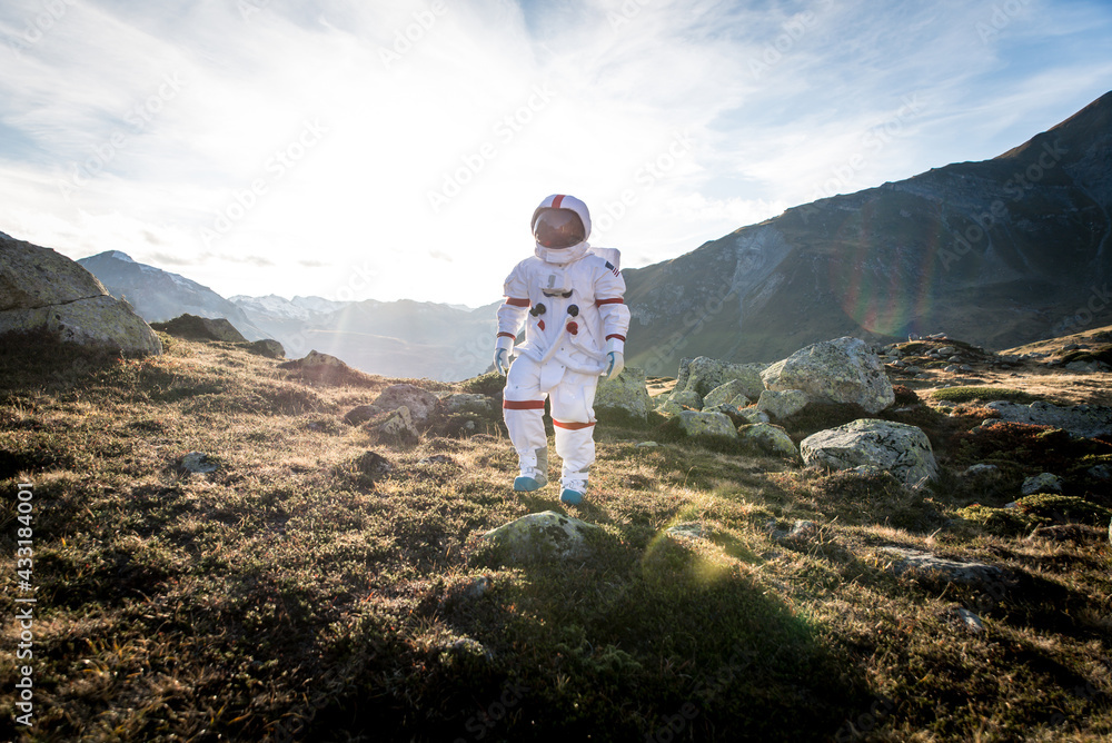 Fototapeta premium Astronaut exploring a new planet. Searching for a new home for humanity. Concept about science and nature