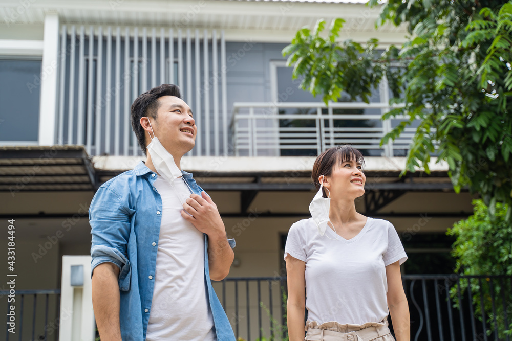 Asian young couple taking off face mask, and breathing fresh air. Asian young couple taking off face mask, and breathing fresh air.