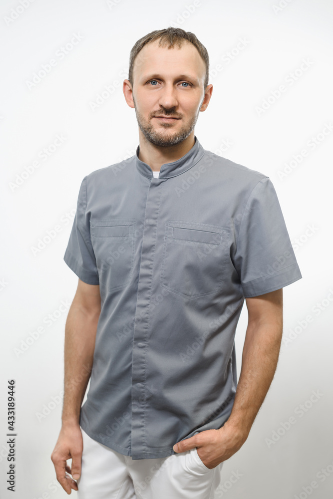 Portrait of friendly gray doctor in grey robe isolated over white background Portrait of friendly gray doctor in grey robe isolated over white background