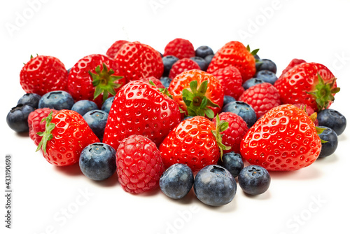 Strawberries  raspberries and blueberries on a white background.