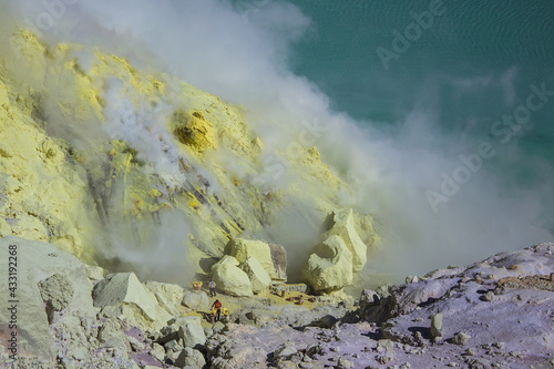 Gas coming out of the sulphur mines and a toxic gas eruption in the crater lake on the bottom of Mount Ijen active volcano, Banyuwangi, East Java, Indonesia. 