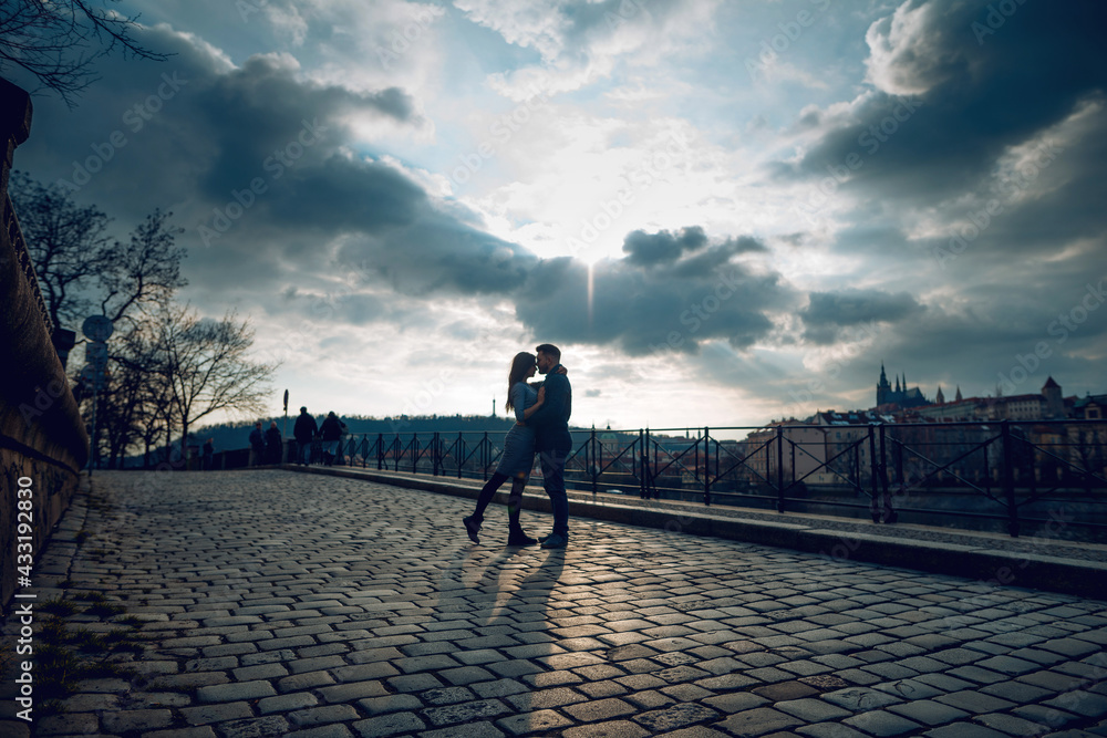 Loving young couple walking around Prague, Czech Republic