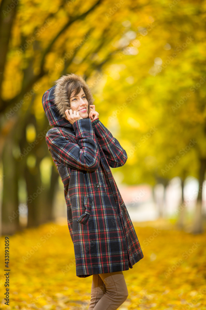 portrait of beautiful woman wearing sweater in autumn yellow park portrait of beautiful woman wearing sweater in autumn yellow park