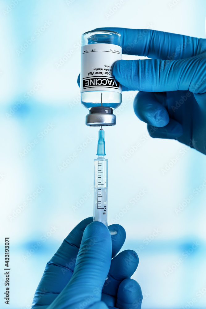 Hands With Generic Injectable Vaccine Vial For The Vaccination Program 