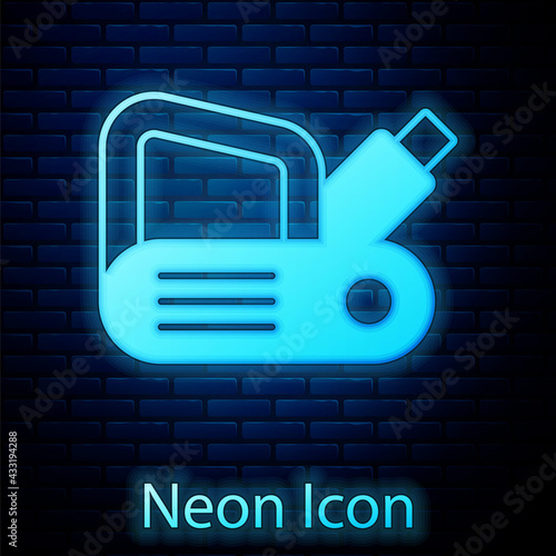 Glowing neon Electric planer tool icon isolated on brick wall background. Vector