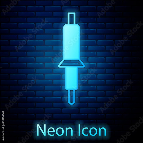 Glowing neon Soldering iron icon isolated on brick wall background. Vector