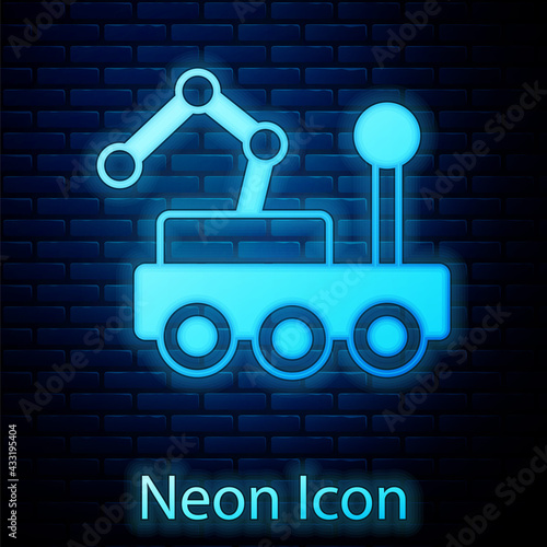 Glowing neon Mars rover icon isolated on brick wall background. Space rover. Moonwalker sign. Apparatus for studying planets surface. Vector