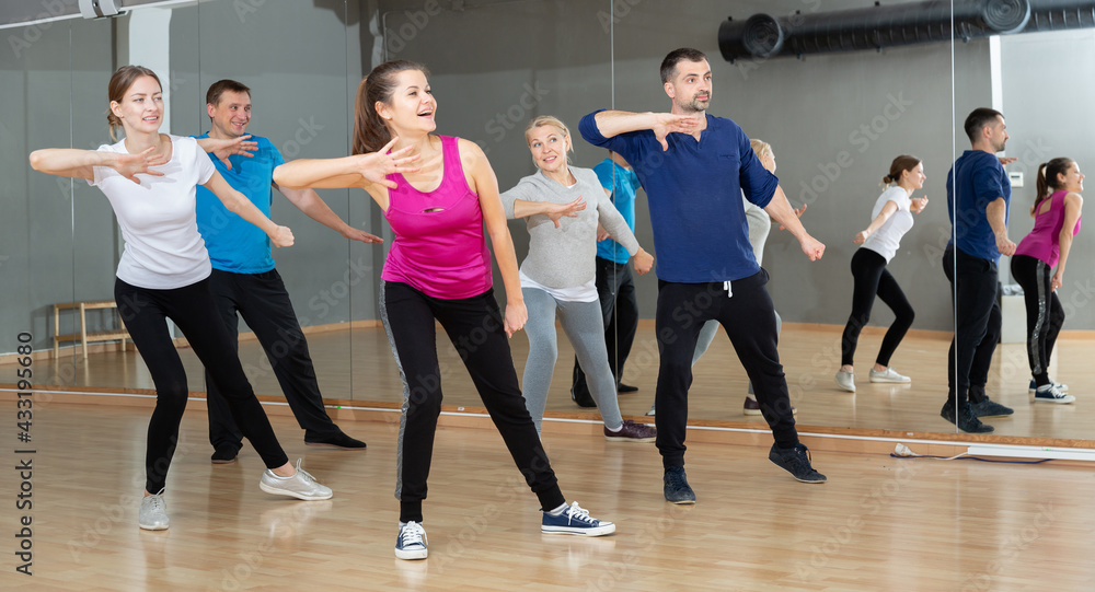 Dance class for adult people, positive young and mature men and women training in dance studio