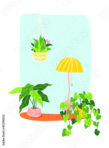 home flowers on a windowsill with a table lamp. cozy window with flowers.