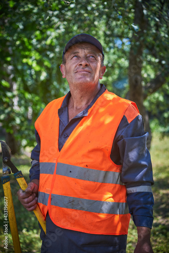 Portrait of smiling old man wearing safety vest